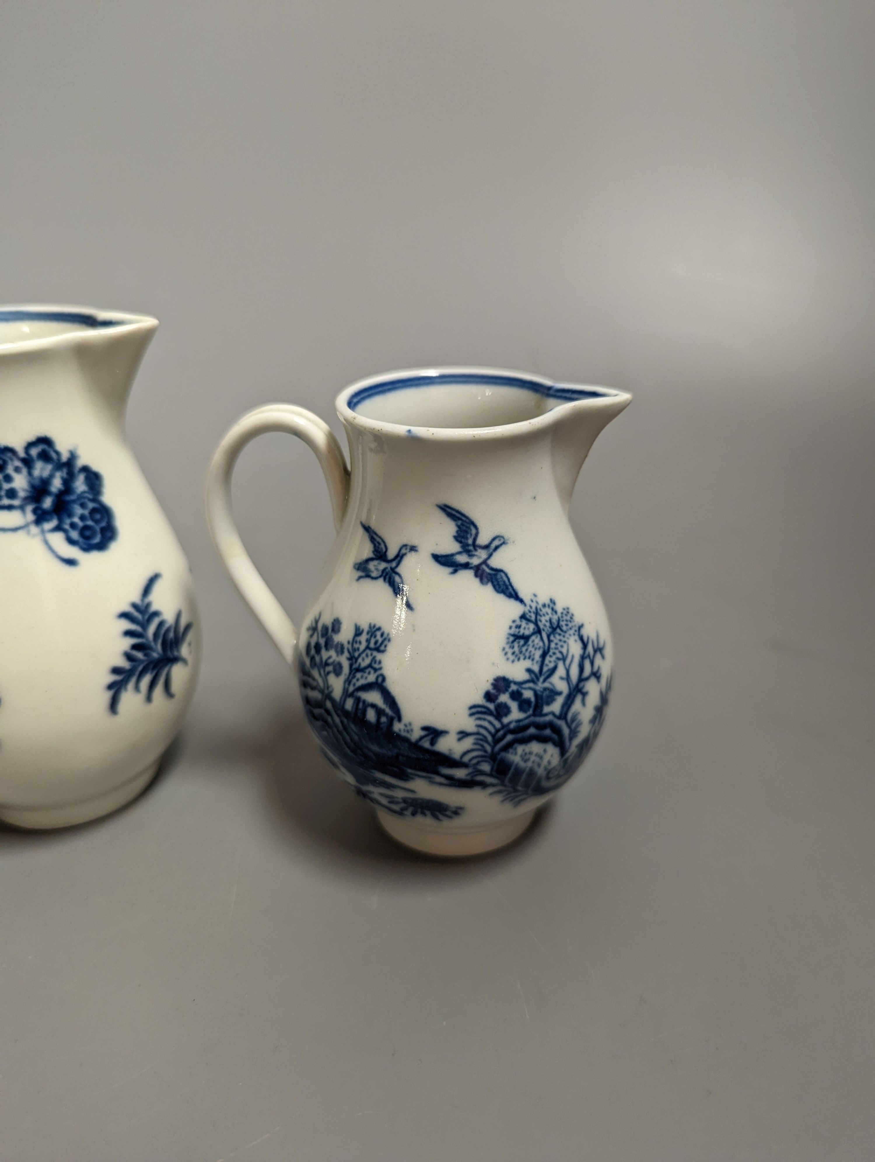 A Caughley sparrowbeak jug printed with the Three Flowers pattern and another printed with the Fence pattern, S marks